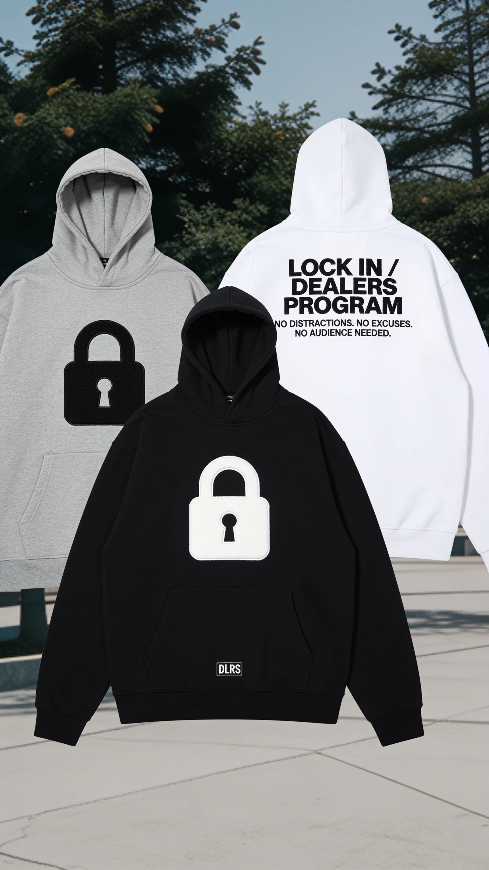 Black, gray, and white Dealers Program hoodies styled outdoors